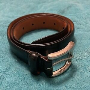 Cole Haan Leather Black Belt men's Size 34. Buckle is solid brass. Good Preowned